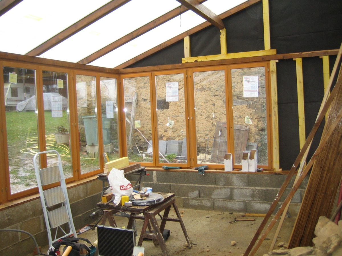 Much nicer working indoors once the roof is on. We can also start drying out.